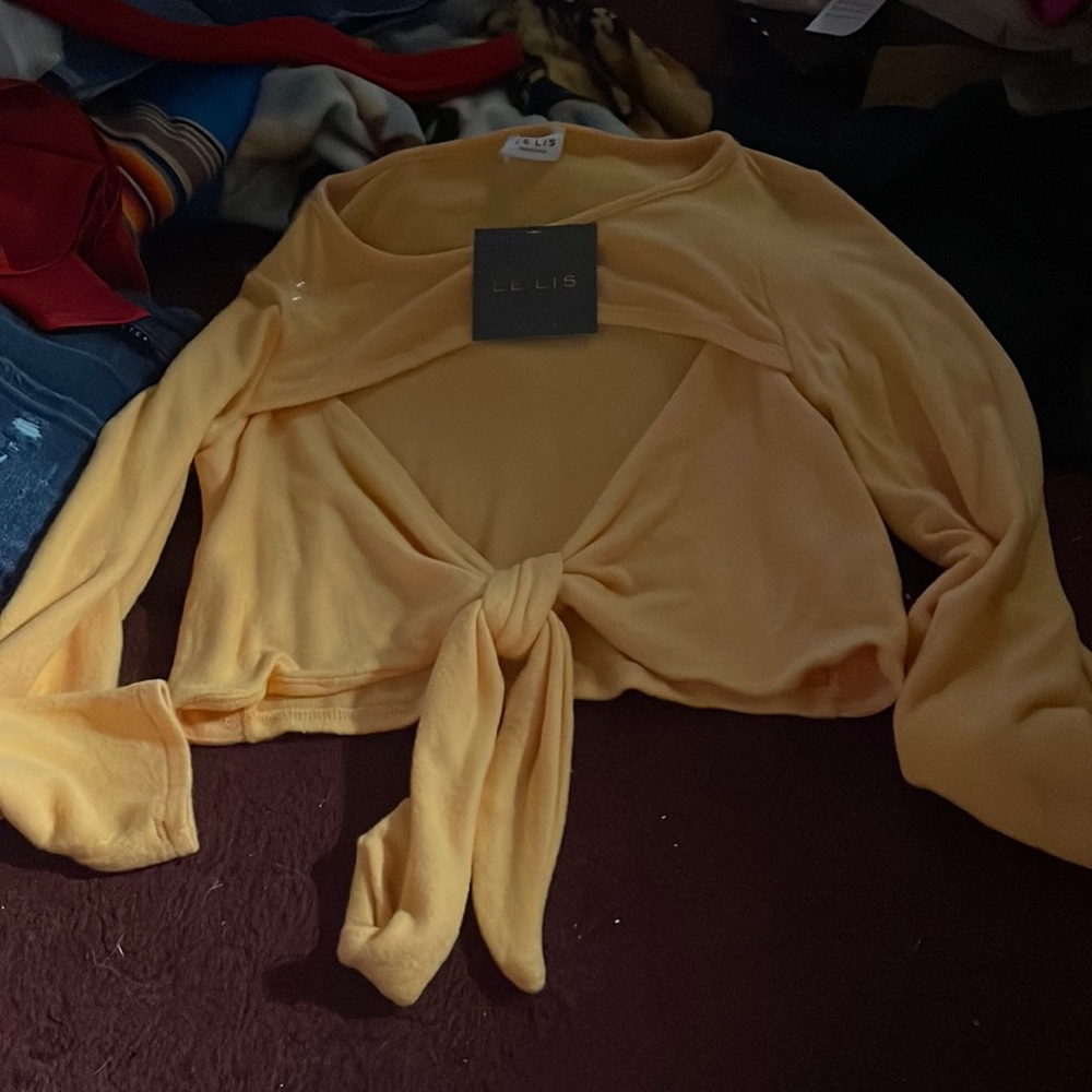 Yellow sweater.